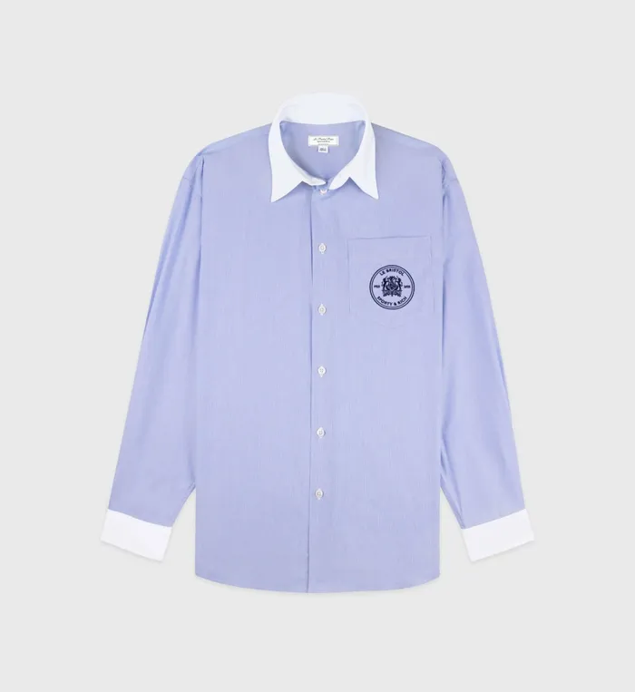 Sporty and Rich Shirting Women Bristol Crest Oversized Shirt 8211 WhiteNavy Stripe Sporty and Rich Shirting Women Bristol Crest Oversized Shirt 8211 WhiteNavy Stripe